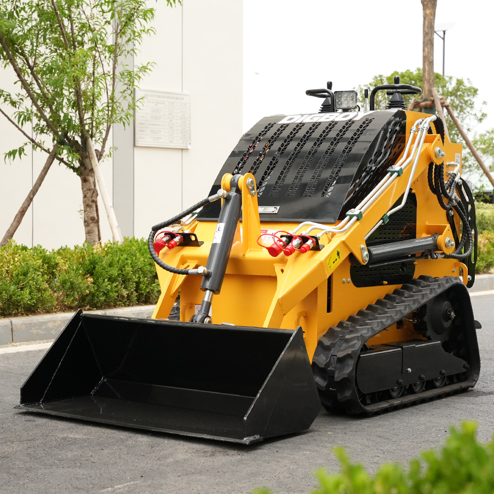 The compact DIG-BOY DBL-T460 stand-on mini track loader accessing a narrow job site