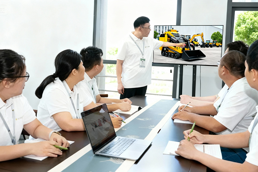Technician performing compact equipment maintenance on a DIG-BOY machine